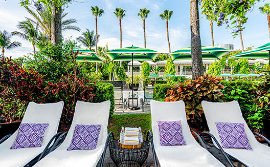 poolside private cabanas with local artist artwork